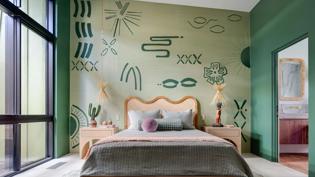Tailored bedroom with a hand-drawn botanical statement wall